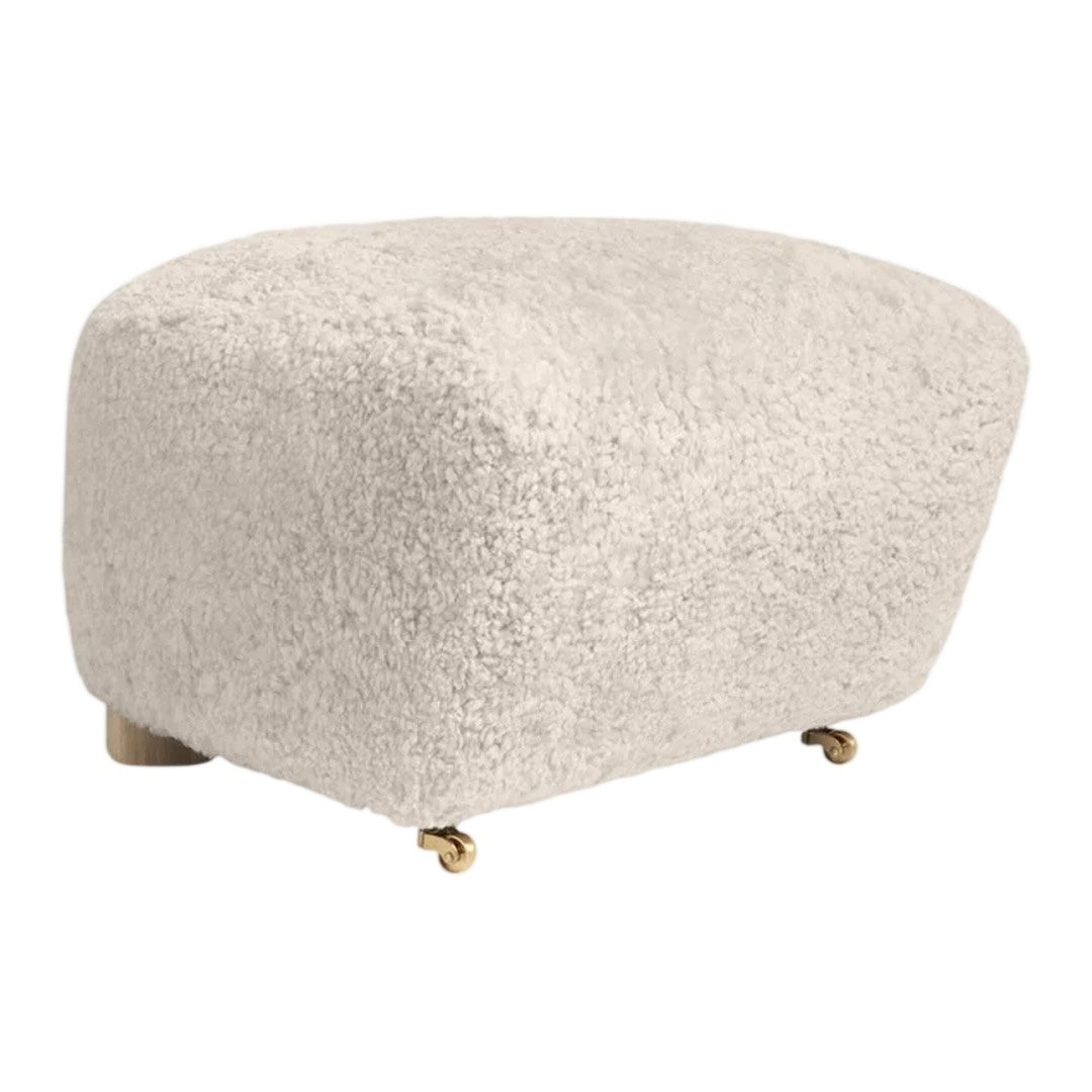 Soft beige boucle upholstery with a smooth, rounded shape and subtle texture. Stylish, minimalistic design.