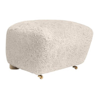 Soft beige boucle upholstery with a smooth, rounded shape and subtle texture. Stylish, minimalistic design.