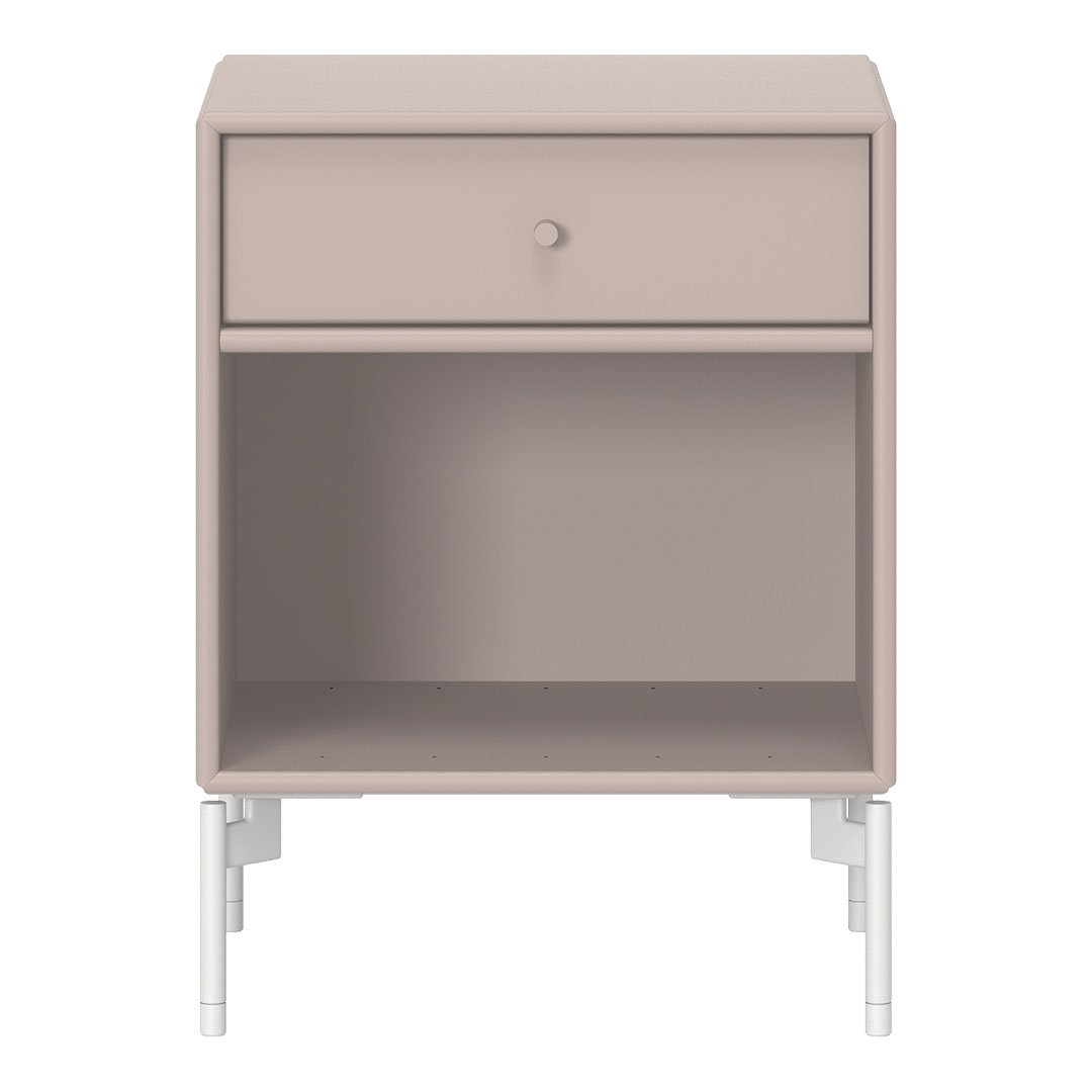 Blush pink nightstand with a smooth finish and white metal legs, featuring a minimalist design and single drawer.