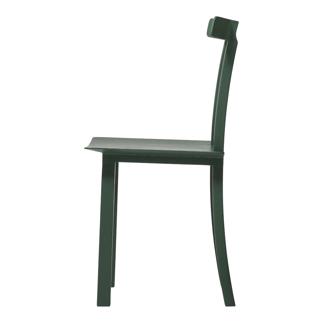 Side view of a sleek green chair with a minimalist design and smooth, curved lines. Ideal for modern décor.