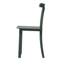 Side view of a sleek green chair with a minimalist design and smooth, curved lines. Ideal for modern décor.