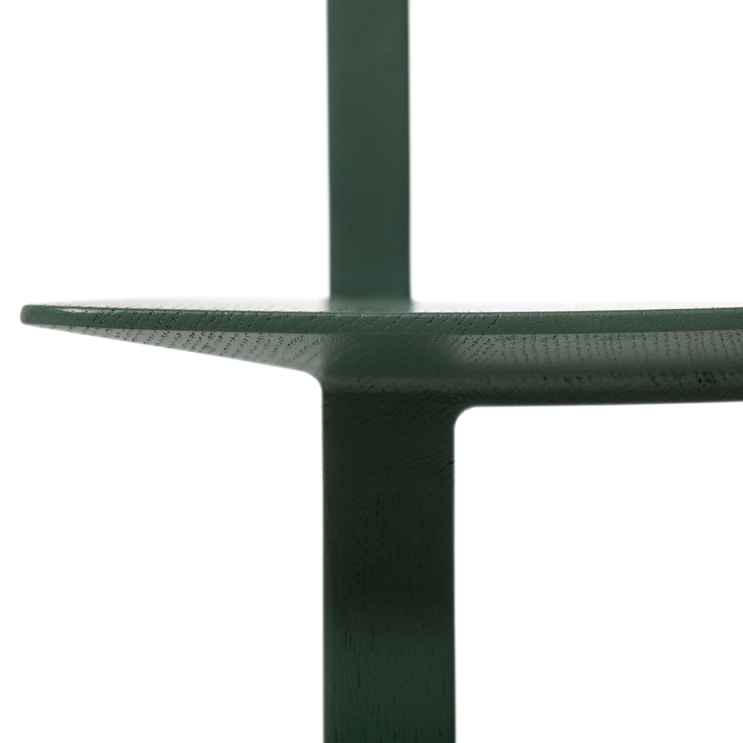 Dark green shelf with a sleek, minimal design and textured surfaces. Ideal for modern home decor.