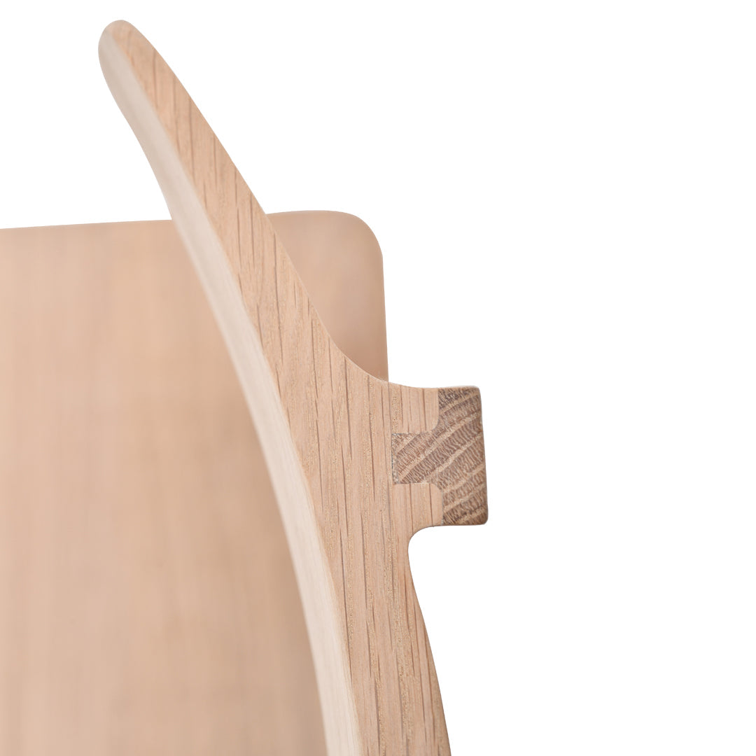 Natural light wood grain with smooth, curved edges; a minimalist design showcasing warm beige tones.