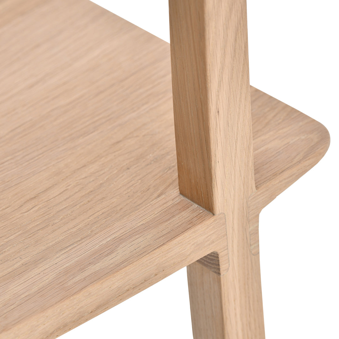 Light oak wood finish with a smooth, natural grain pattern, showcasing minimalist design elements.