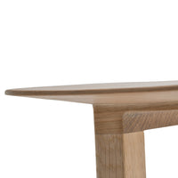 Light wood table with a smooth, natural finish and subtle grain patterns. Clean lines and modern design elements.