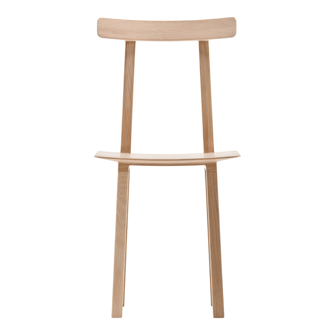 Natural wood chair with a light beige finish and minimalist design, showcasing smooth lines and subtle textures.