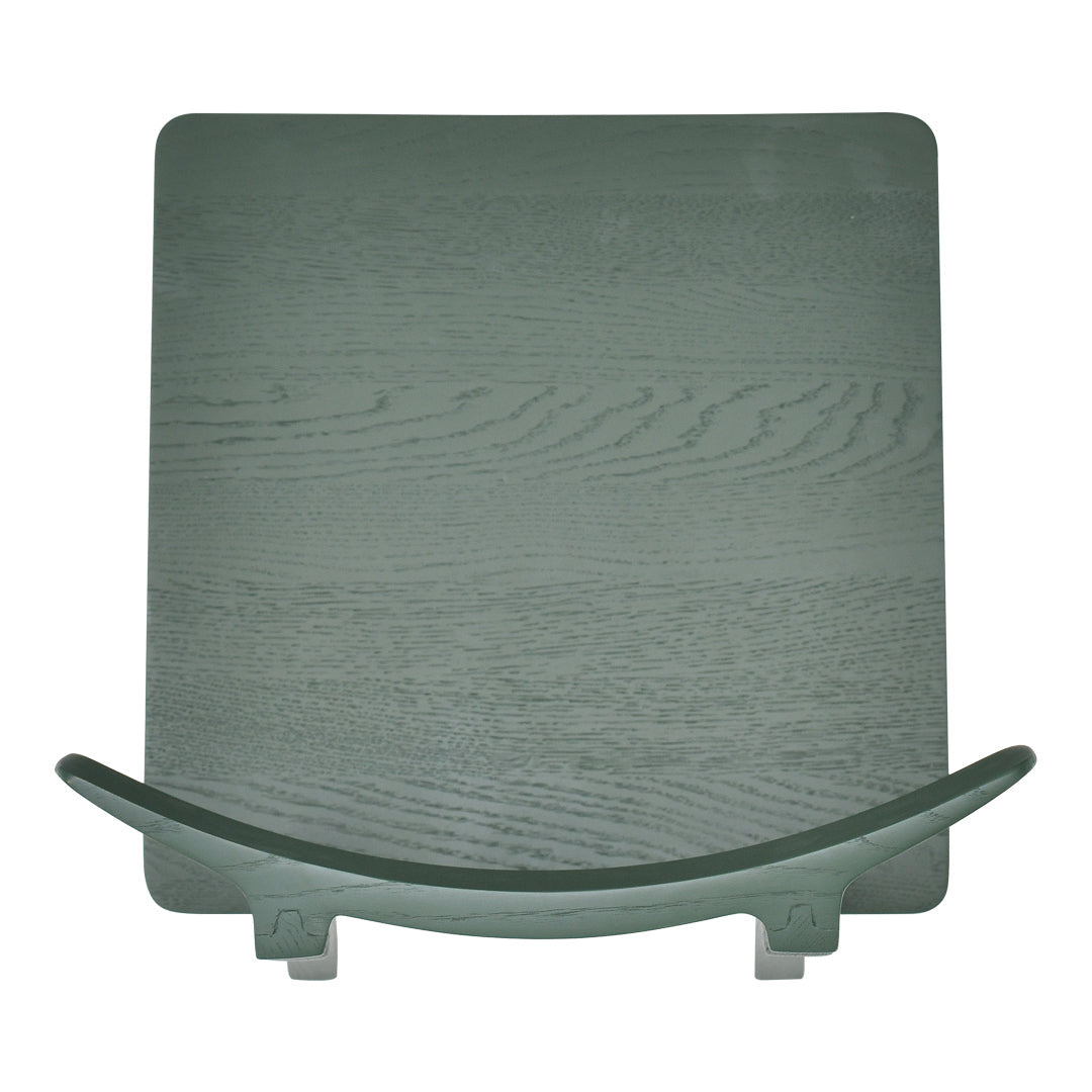Green wooden table with a smooth, flat surface and curved edges, showcasing a natural wood grain pattern.