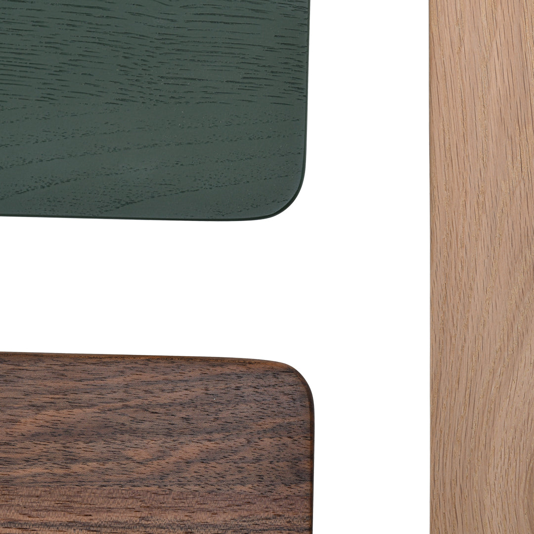 "Close-up of green, brown, and light wood patterns on a tabletop design, showcasing rich textures and colors."