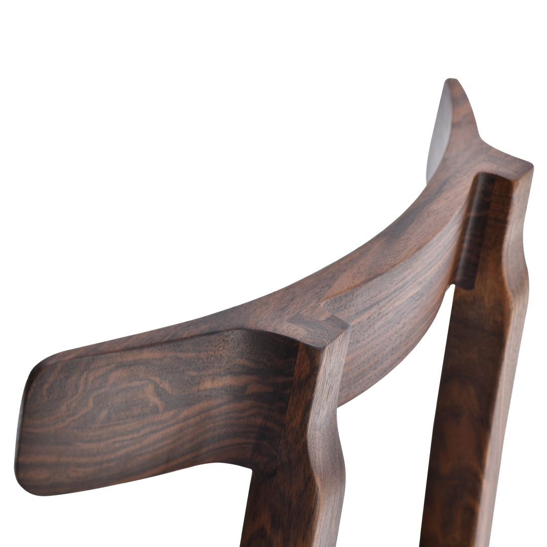 Dark walnut wood with smooth, rich grain patterns and rounded edges for a sleek, modern look.