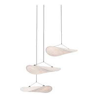 Modern hanging light fixture with soft, white shades and sleek, minimalist design. Perfect for contemporary spaces.