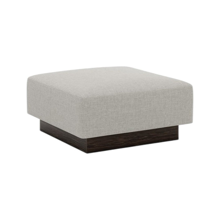 Light gray upholstered ottoman with a smooth, minimalist design and dark wood base. Ideal for modern decor.