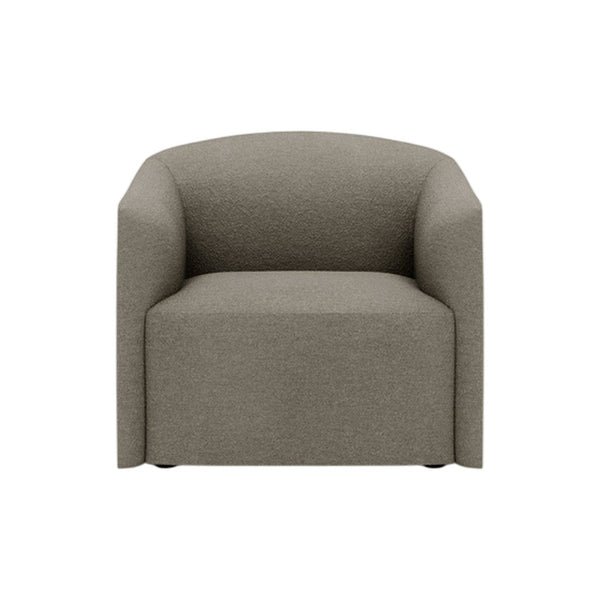 Soft beige armchair with a simple, textured fabric and rounded edges, perfect for modern interiors.