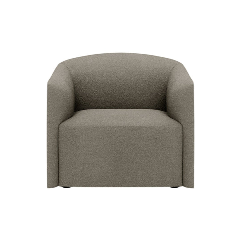 Soft beige armchair with a simple, textured fabric and rounded edges, perfect for modern interiors.