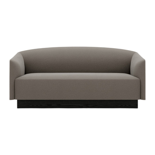 Gray upholstered sofa with a smooth, minimalist design and a sleek black base. Perfect for modern interiors.