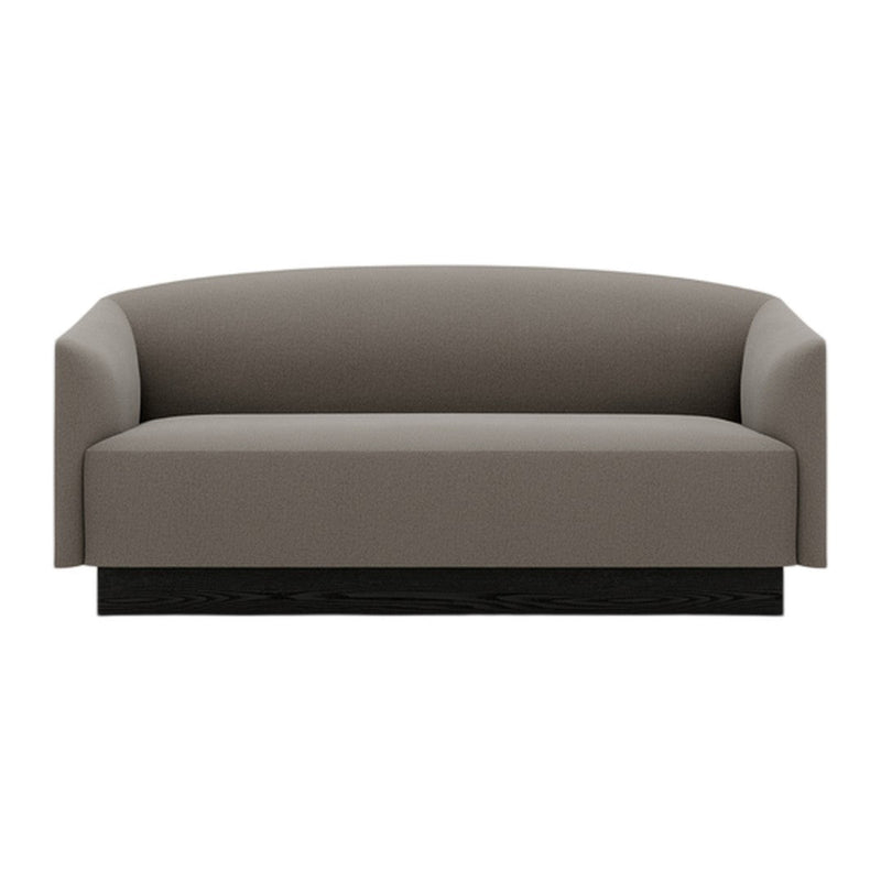 Gray upholstered sofa with a smooth, minimalist design and a sleek black base. Perfect for modern interiors.
