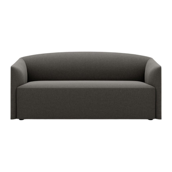 Modern dark gray sofa with a minimalist design and smooth, curved lines. Perfect for contemporary living spaces.