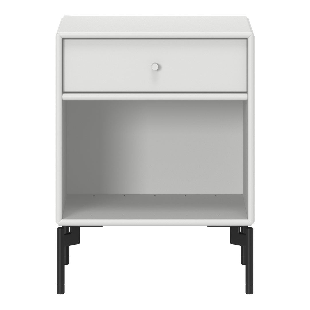 White nightstand with a minimalist design and sleek black legs. Simple, clean lines and no visible patterns.