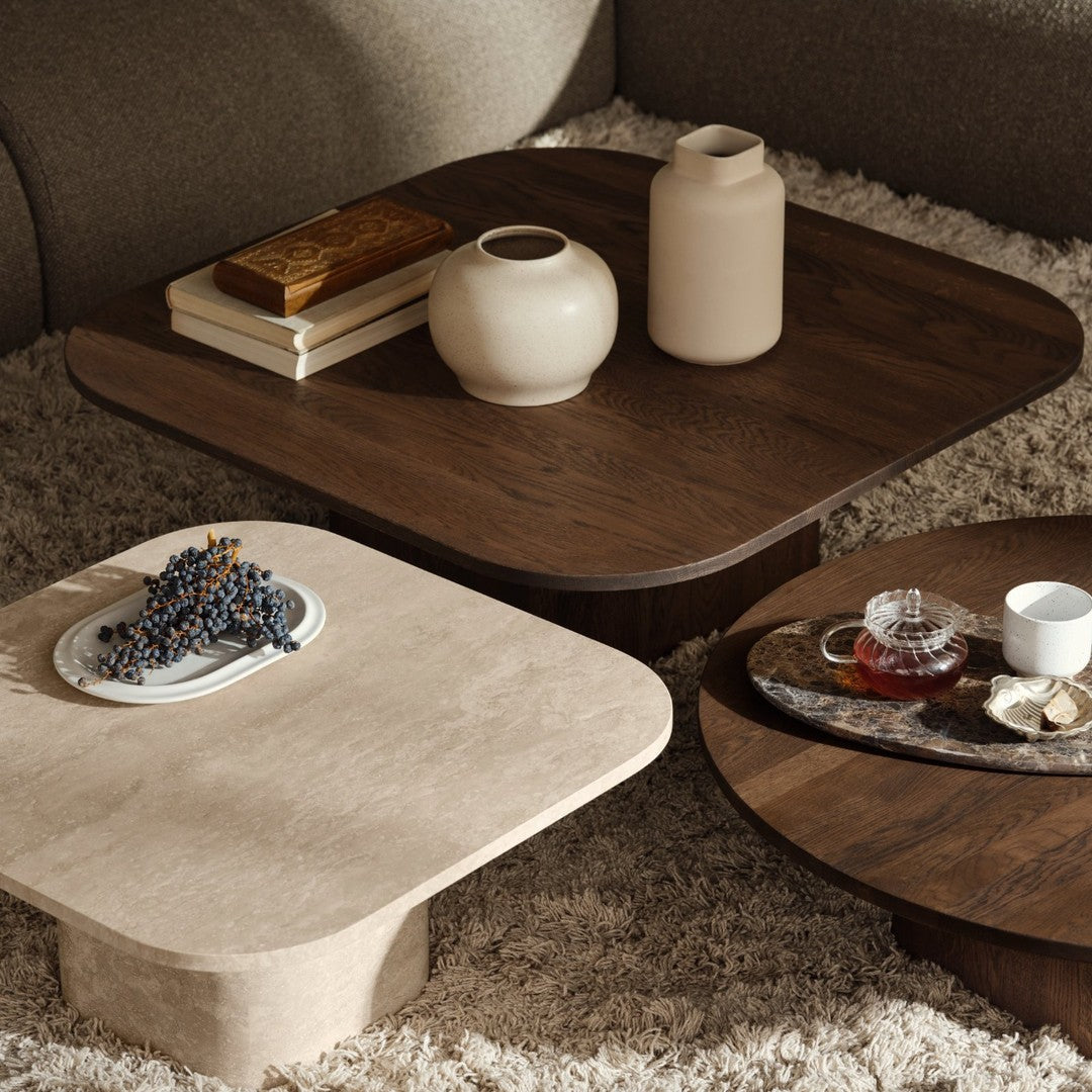 "Set of stylish square coffee tables in warm beige and rich walnut, showcasing smooth finishes and elegant silhouettes."