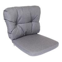 Gray tufted cushion with a smooth, solid pattern, designed for comfort and style in any space.