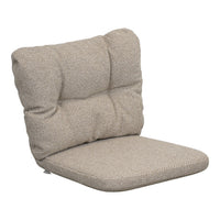 Tan textured cushion chair with a subtle woven pattern and plush, tufted backrest for added comfort.