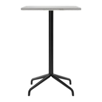 White marble tabletop with sleek black metal legs in a modern, minimalist design. Perfect for contemporary spaces.