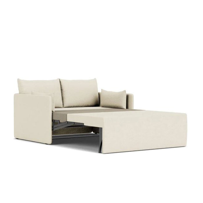 Light beige sofa with a smooth, solid fabric and plush cushions for a modern, minimalist aesthetic.