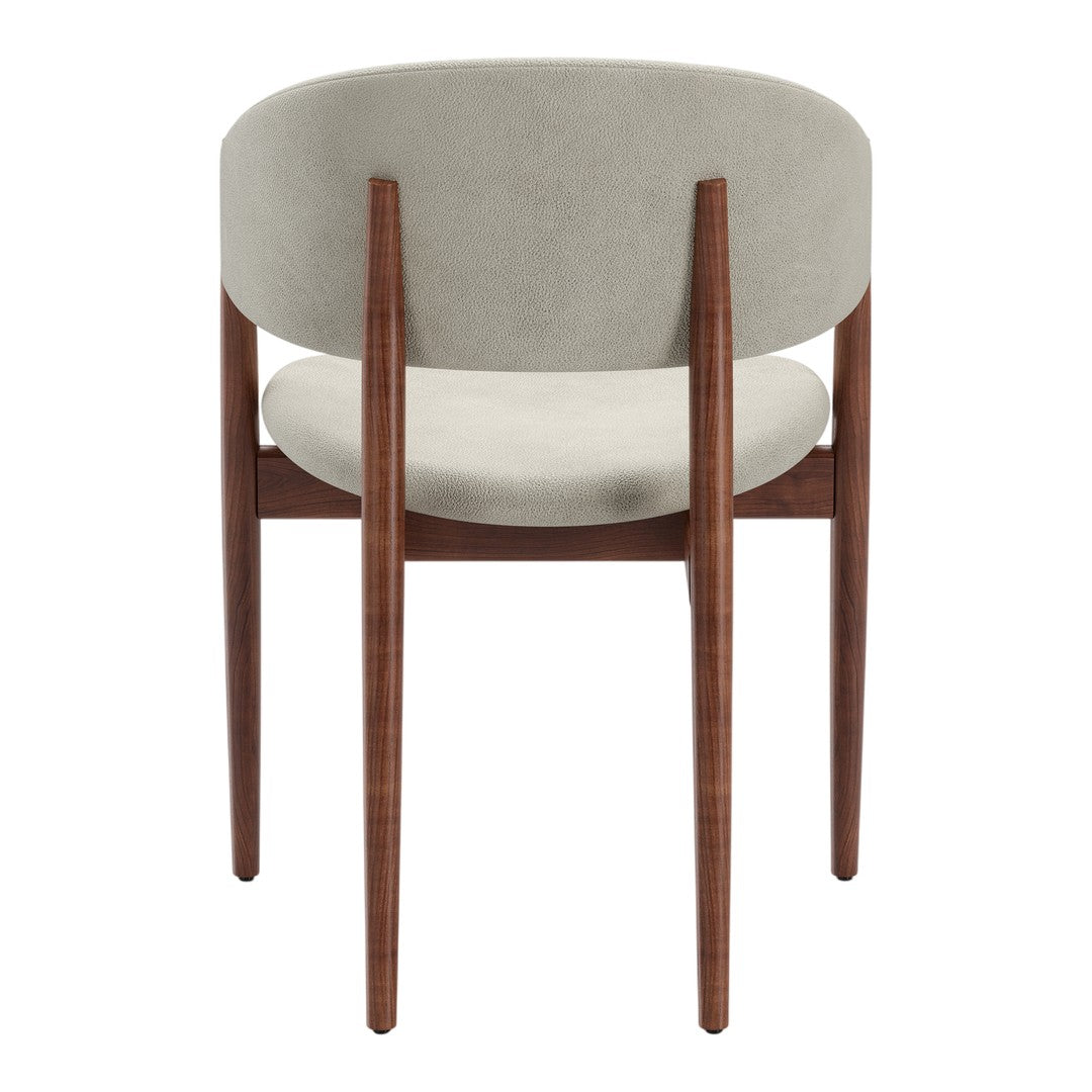 Minimalist gray velvet chair with a smooth, rounded back and sleek walnut wood legs. Perfect for modern decor.
