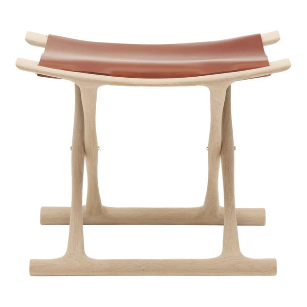 Natural wood frame with a smooth, rich brown leather seat, showcasing minimalist design and contrasting textures.