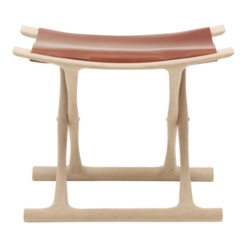 Natural wood frame with a smooth, rich brown leather seat, showcasing minimalist design and contrasting textures.