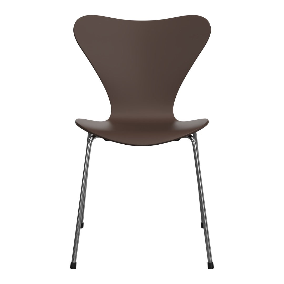 Brown molded chair with sleek chrome legs, featuring a minimalist design and smooth, curved lines.
