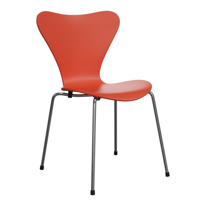 Bright orange chair with a sleek, modern design and smooth, contoured seat; complemented by sleek metal legs.