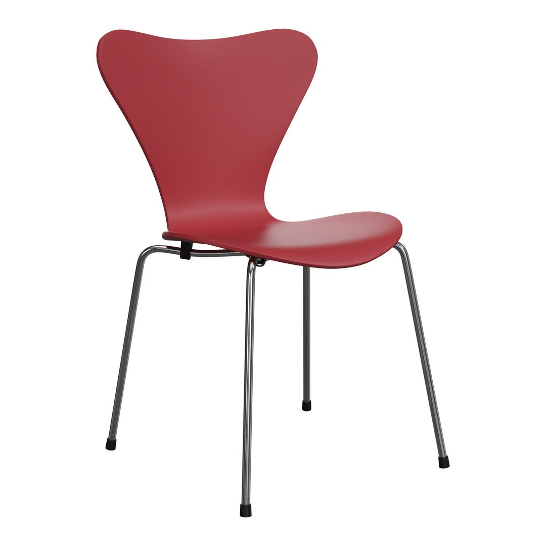Red butterfly chair with smooth contours and sleek chrome legs, perfect for modern decor. 