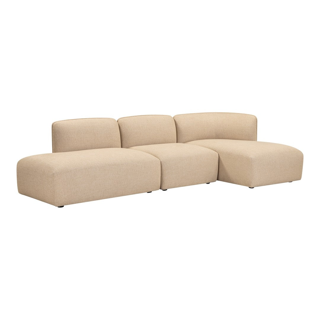 Beige sectional sofa with a smooth, minimalist design, featuring plush cushions and rounded shapes for a modern aesthetic.