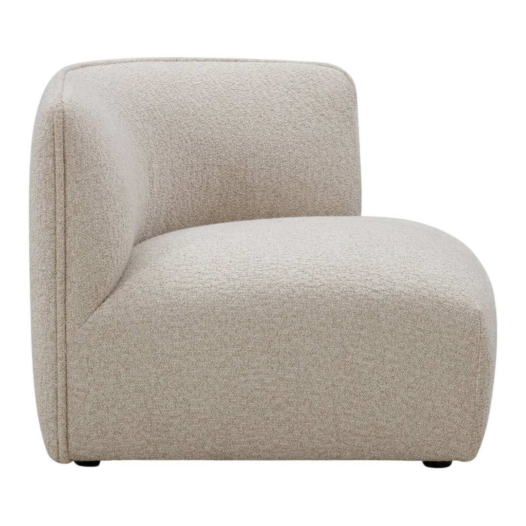 Beige curved accent chair with a soft textured pattern, ideal for modern living spaces.