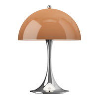 Modern lamp with a glossy orange dome shade and sleek chrome base, featuring a minimalist design.