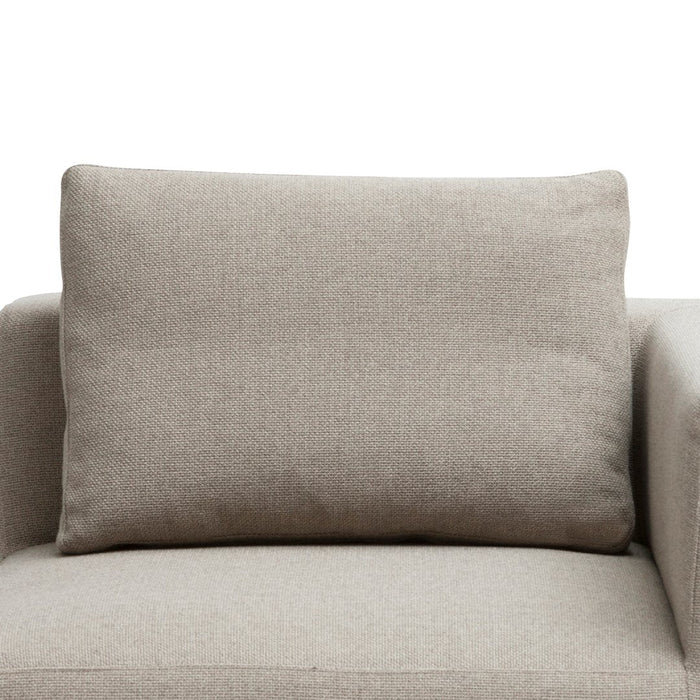 Beige textured cushion with a minimalist design, perfect for modern home decor.