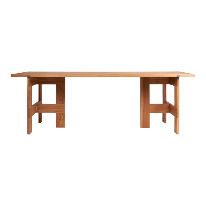 Solid oak table in a warm natural wood finish, featuring a simple, modern design with clean lines and no visible patterns.