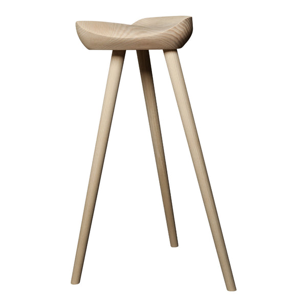 Natural wood stool with a smooth, light finish and minimalist design, featuring tapered legs and a curved seat.