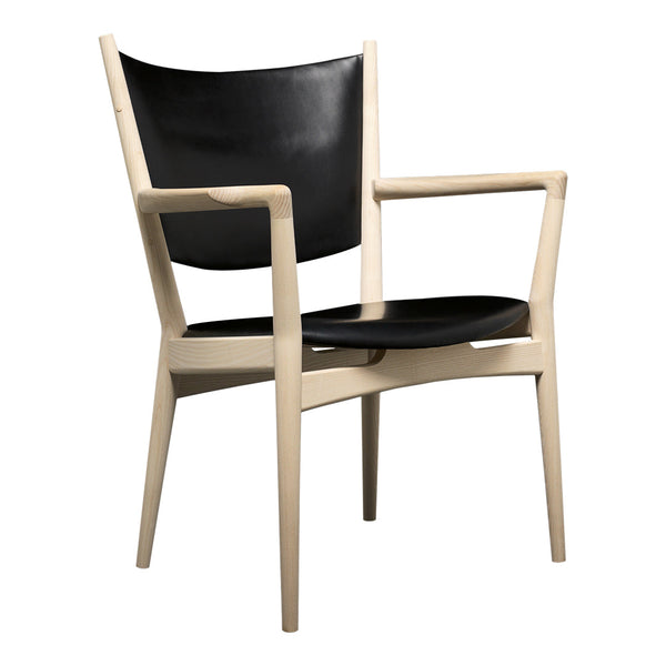 Black leather seat and backrest with natural wood frame, showcasing a modern, minimalist design.