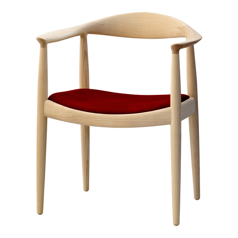 Natural wood chair with a minimalist design and a deep red velvet seat, showcasing smooth curves and elegant lines.