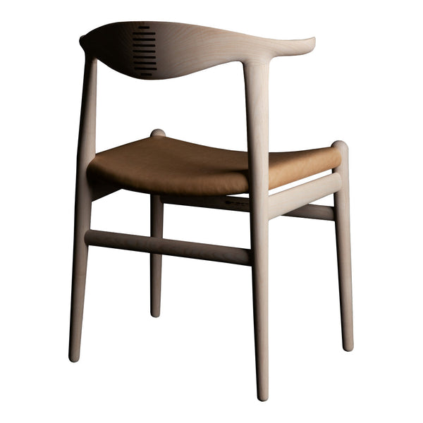 Light wood chair with a natural finish and a warm brown woven seat, featuring a minimalist design.