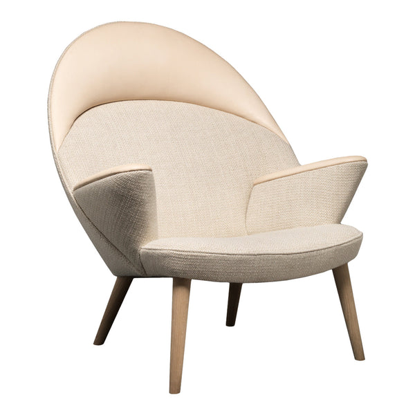 Beige and light cream upholstered chair with an elegant curved design and minimalist wooden legs.