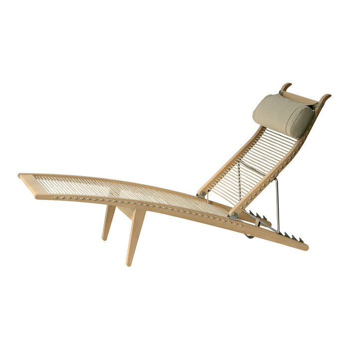 Light wooden lounge chair with a sleek design, featuring a cream-colored padded headrest and a woven seat pattern.