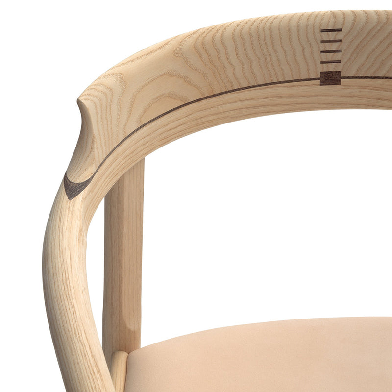 Light wood chair with smooth natural finish and subtle contrasting wood inlay details. Soft beige seat upholstery.