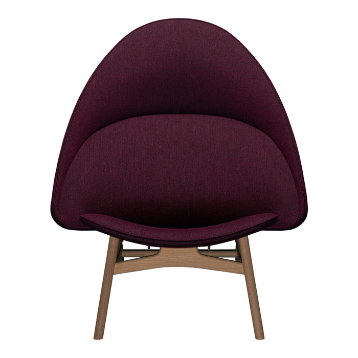Modern chair with a deep burgundy fabric and subtle texture, featuring a minimalist wooden frame.