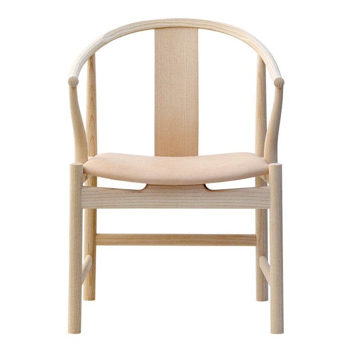 Light natural wood chair with a soft beige cushion, featuring a minimalist design and smooth, curved lines.