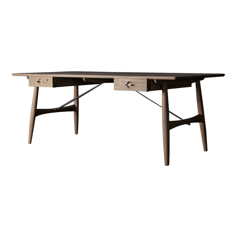 Modern wooden desk in warm brown with a smooth finish and minimalist design, featuring two drawers.