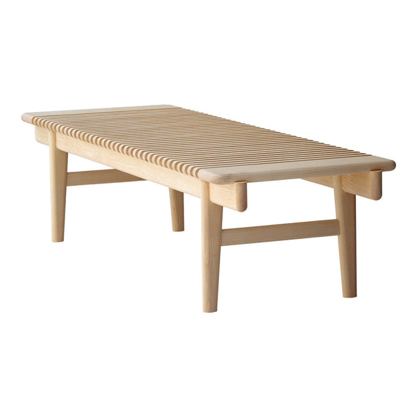Light wood coffee table with slatted design and natural finish, showcasing a simple and modern aesthetic.