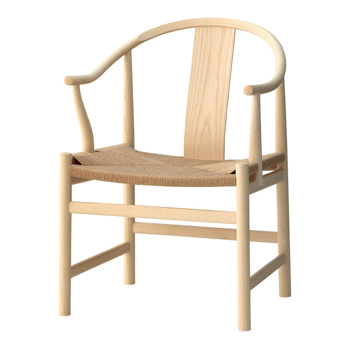 Light wood chair with a curved back and woven seat, showcasing a minimalist design and natural tones.
