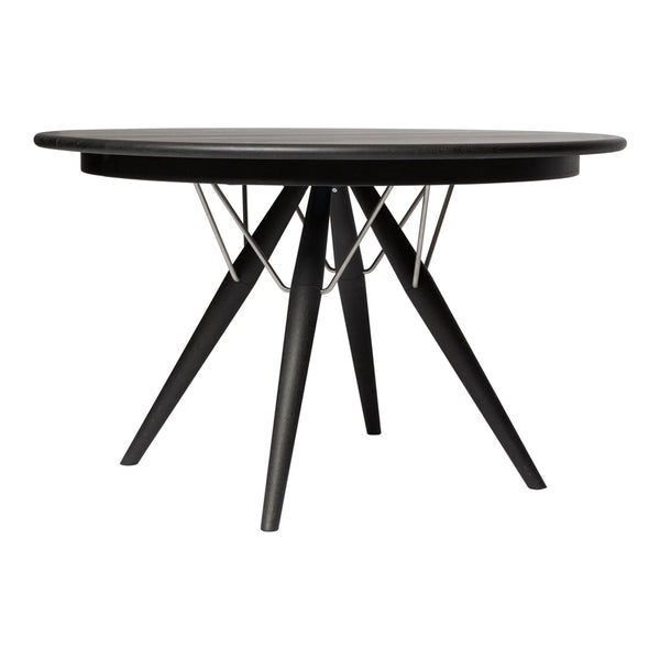 Black round dining table with a geometric wire design and tapered wooden legs. Sleek modern aesthetic perfect for any decor.